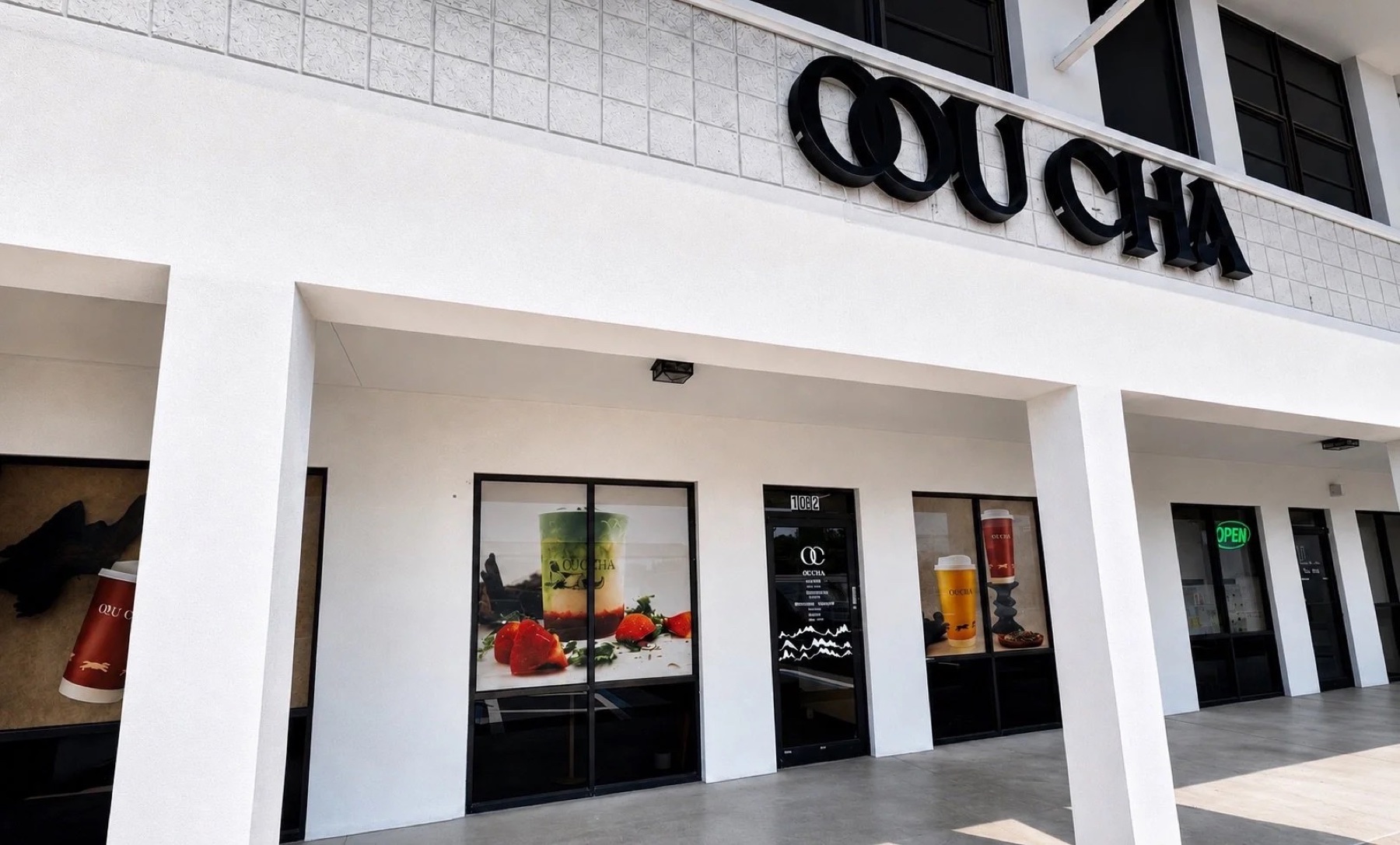 Oou Cha storefront with black lettering above white columns in Pinellas Park