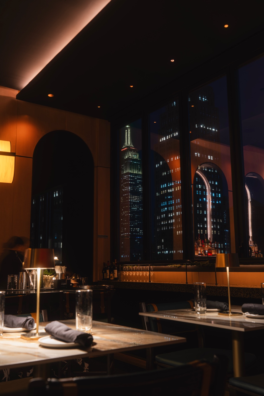 Candlelit dining room with the skyline through the windows