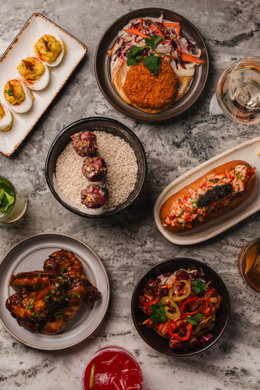 Overhead spread of shared plates and drinks