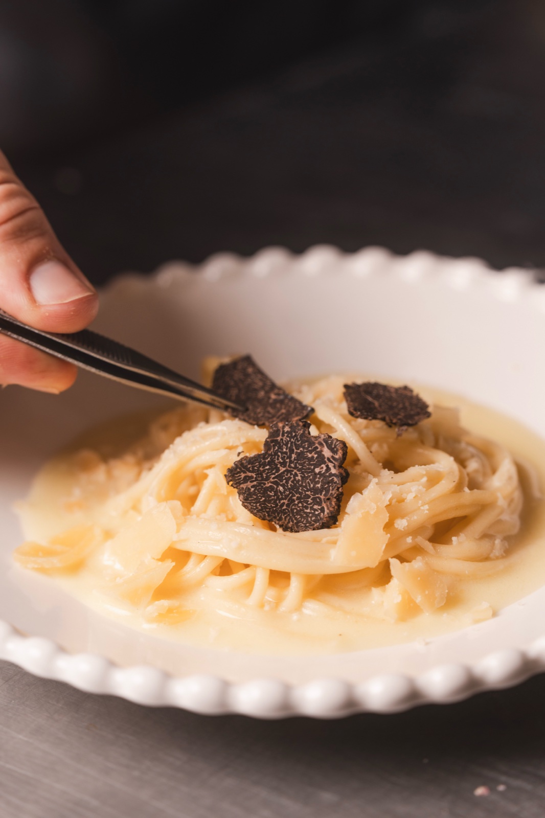 Black truffle shaved over creamy pasta