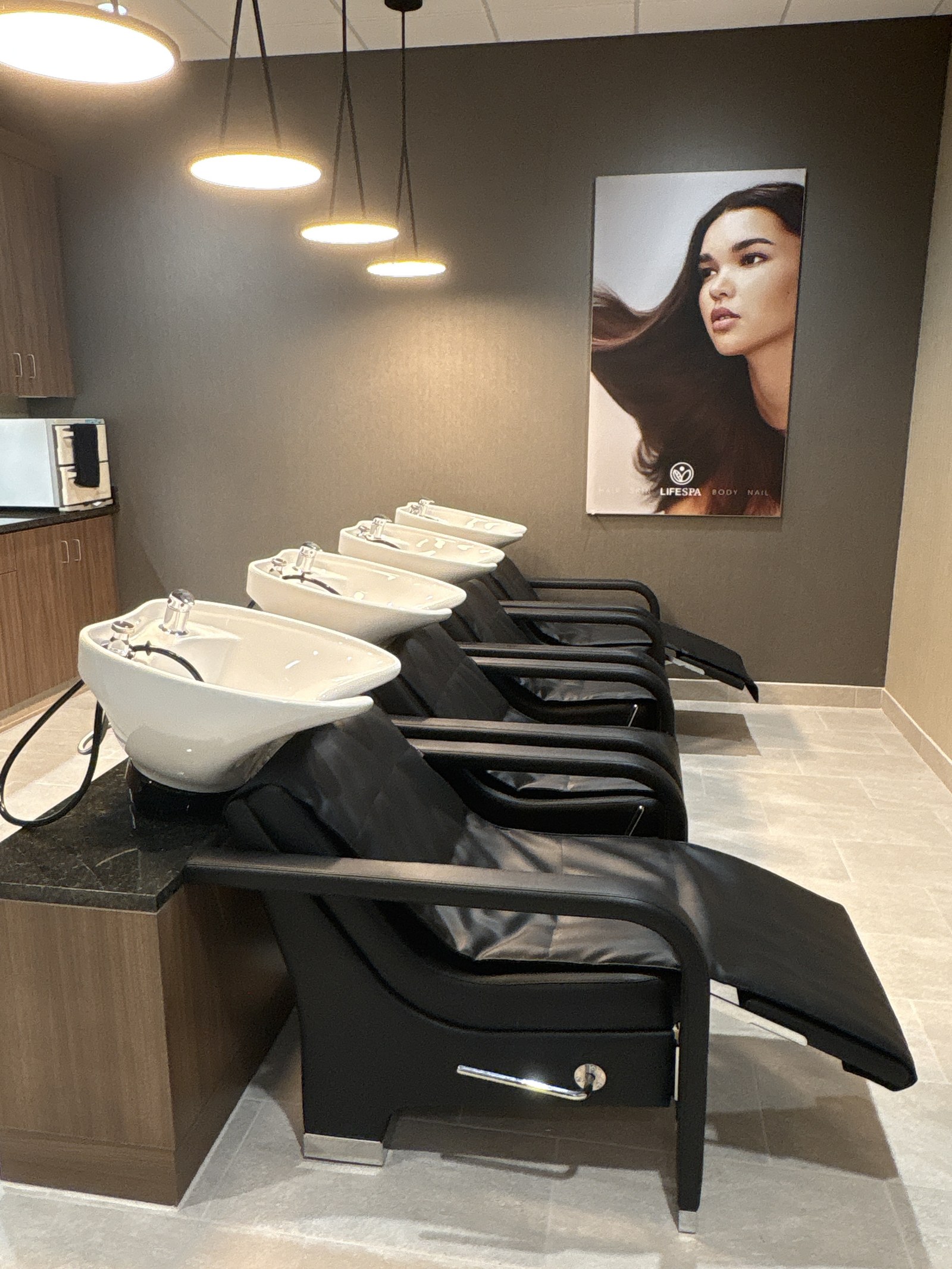 Three shampoo bowls and reclining chairs in the LifeSpa salon.